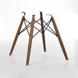 Angled rear view of Light Oak dowel base for Eames side and arm shells