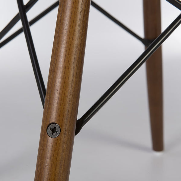 Close up leg view of Light Oak dowel base for Eames side and arm shells
